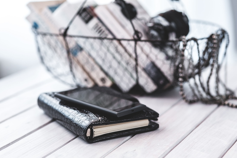 group of objects, day, paper, spiral notebook, items, black color, books, ink, diary, studio shot, furniture, note pad, white background, focus on foreground