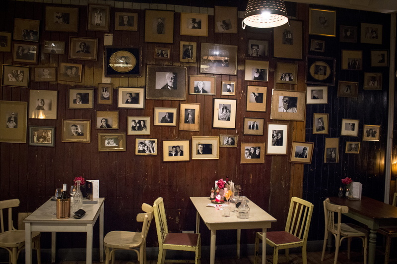 large group of objects, cafe, order, restaurants, electric lamp, arrangement, restaurant, shelf, clock, table, furniture, london, pictures, chair, food and drink