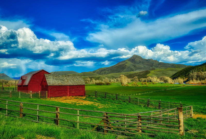 beauty in nature, squaw mountain, landscape, barrier, fence, clouds, plant, rural scene, valley, land, outdoors, barn, tranquil scene, mountain, farm, sky