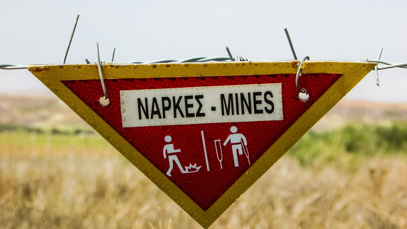 Mines, rural scene, plant, outdoors, Explosive, grass, land, transportation, text, no people, caution, sky, Danger, warning, cyprus, communication, agriculture