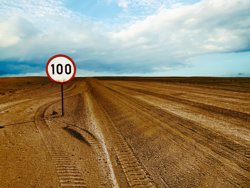cloud - sky, signage, horizon over land, rural, nature, road, tranquility, brown, desert, sky, field, travel, beauty in nature, no people, highway, daytime