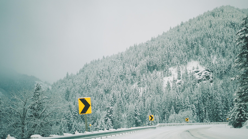 mountains, road, blue, cold temperature, white, street, weather, plant, scenics, black, season, beauty in nature, sign, blizzard, slippery, cold - Temperature