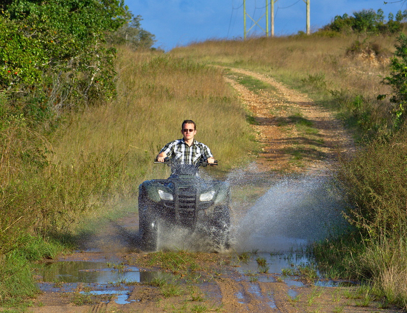 sunlight, outdoors, front view, soil, risk, rancher, plant, grass, summer, vehicle, redneck, country boy, portrait, sitting, ride, 4K, puddle, splash