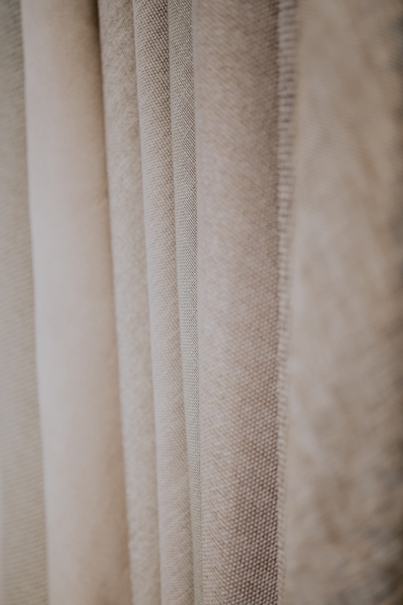 material, indoors, white, full frame, curtain, no people, fabric, fabrics, pattern, colorful, hanging, selective focus, focus on foreground, 4K, textured effect