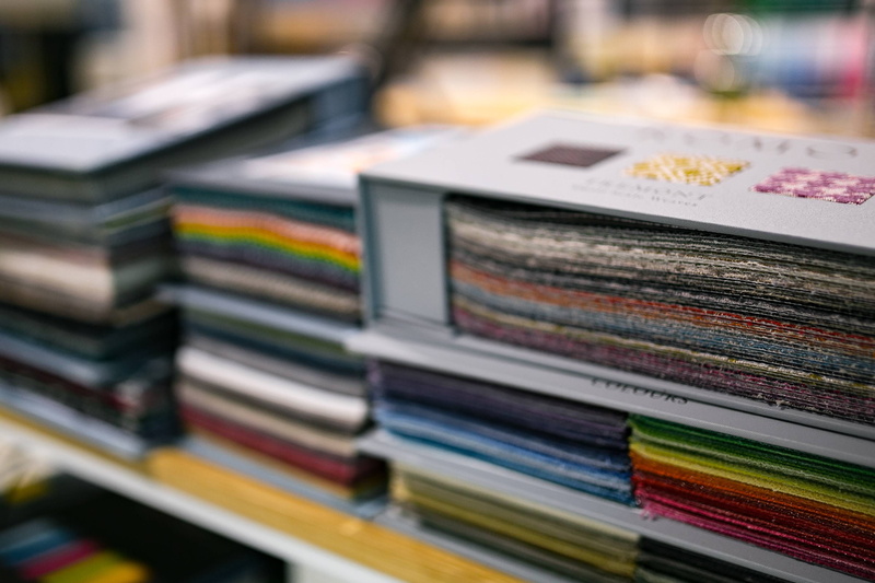 Album, 2K, store, colour, indoors, large group of objects, samples, stack, order, in a row, literature, still life, library, fabric, focus on foreground
