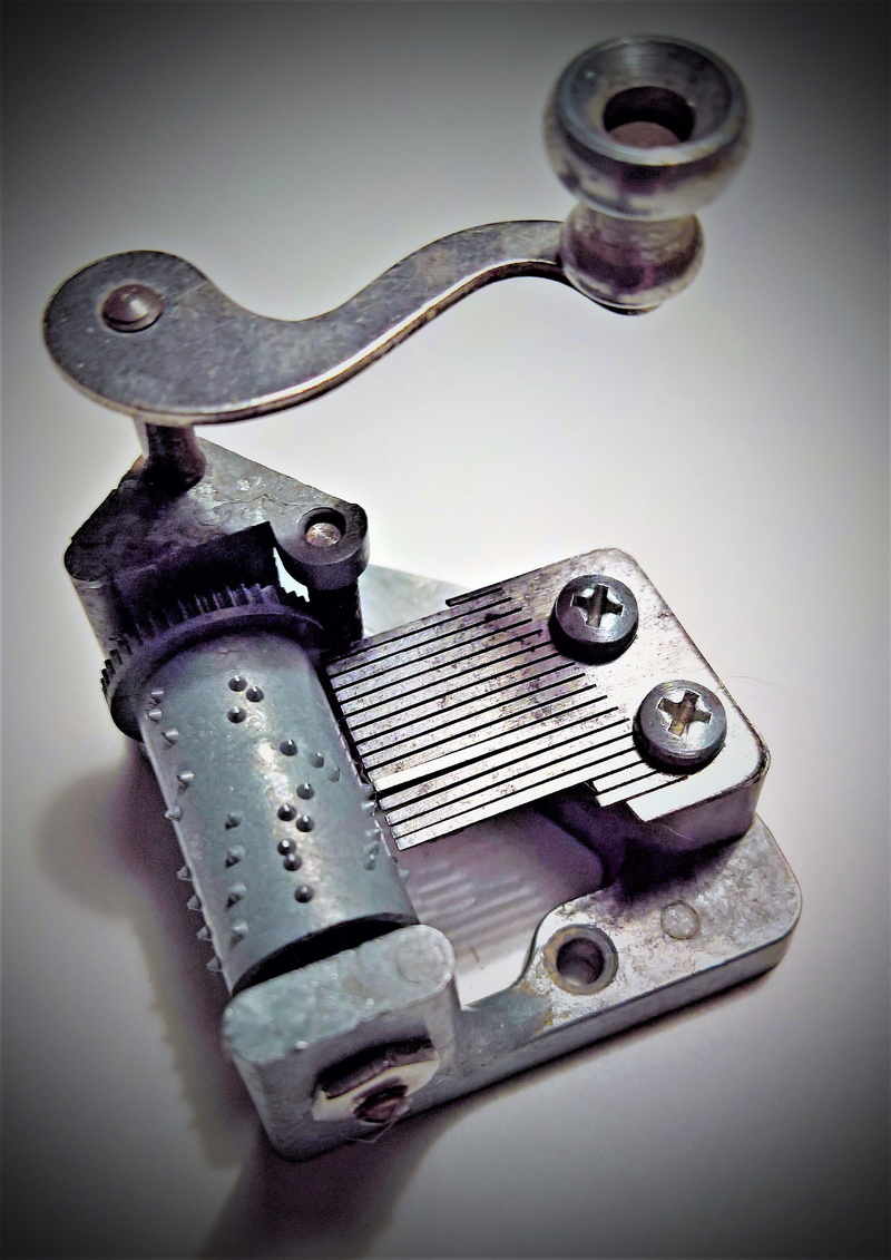 single object, silver colored, Music Box, Game Clock, still life, music, movable tines, vignette, studio shot, tool, equipment, no people, high angle view