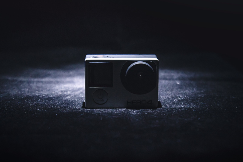single object, black color, flash, gray, surface, technology, record, equipment, close-up, 2K, black background, videos, entertainment, still life, table