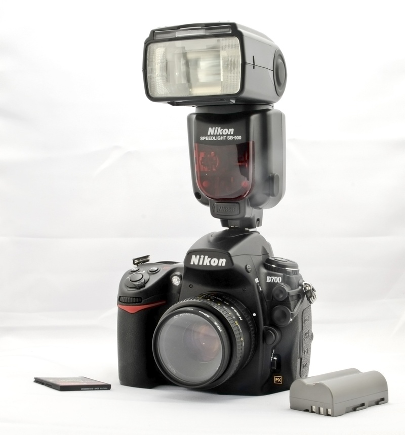 western script, communication, digital camera, no people, dslr, technology, indoors, camera - photographic equipment, d700, nikon, activity, camera, still life