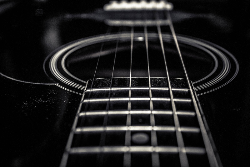 indoors, fretboard, dark, close-up, acoustic guitar, chords, black guitar, black, extreme close-up, pattern, musical equipment, no people, selective focus