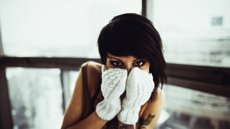 body part, beautiful woman, indoors, young adult, gloves, front view, brunette, emotion, sadness, adult, real people, close-up, illness, one person, looking at camera