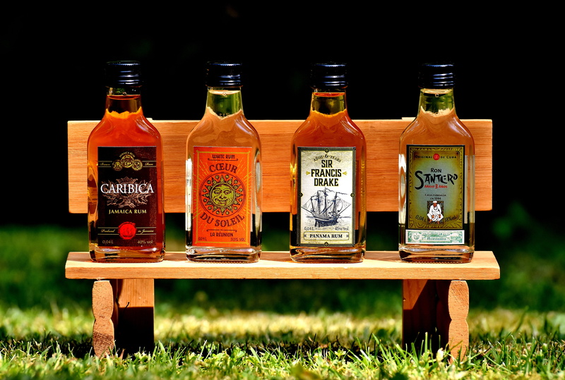 still life, alcoholic beverage, drink, beverage, science, variation, black background, wooden bench, container, choice, wood - material, text, liquid, bottle