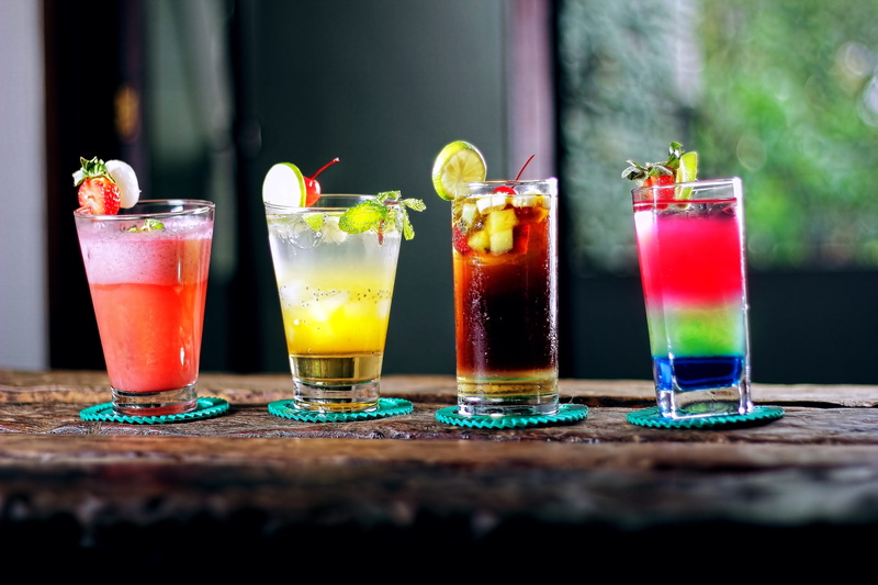 food, liquor, freshness, strawberry, bar counter, party, bar, mint, surface level, alcoholic beverages, refreshment, drinking straw, tequila, beverage
