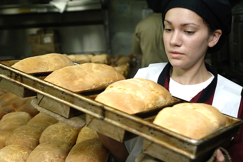 uniform, healthy eating, job, work, flour, kitchen, cook, woman, business, bread, fresh, tray, store, holding, front view, indoors, young adult, adult