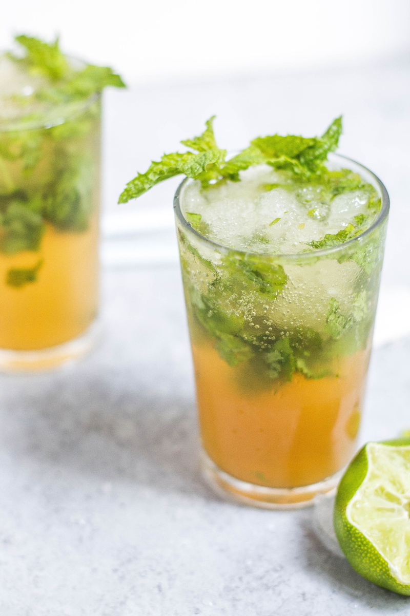 liquid, cocktail, green, leaf, mixed drink, no people, bubbles, household equipment, food and drink, drink, iced tea, drinking glass, alcohol, orange, citrus fruit