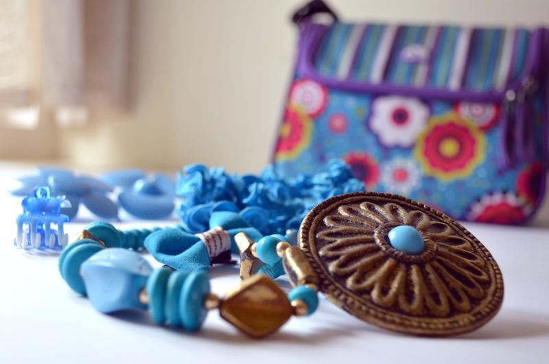 no people, ornaments, woman, accessories, close-up, ornate, bag, variation, indoors, multi colored, art and craft, necklace, blue, focus on foreground