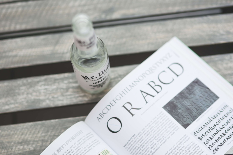 drinking, bottle, tex, table, newspaper, wood - material, high angle view, communication, paper, achievement, finance, close-up, food and drink, print