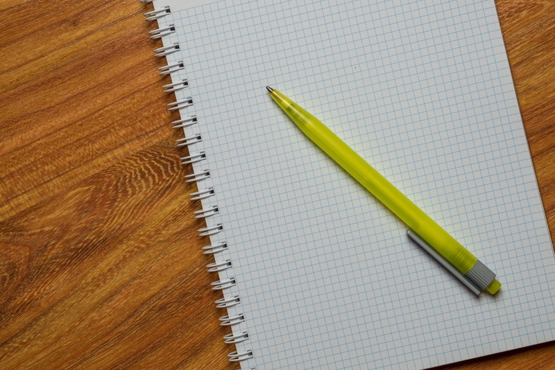writing instrument, wood - material, top, white, education, table, background, spiral, book, high angle view, publication, close-up, school, note pad, pages