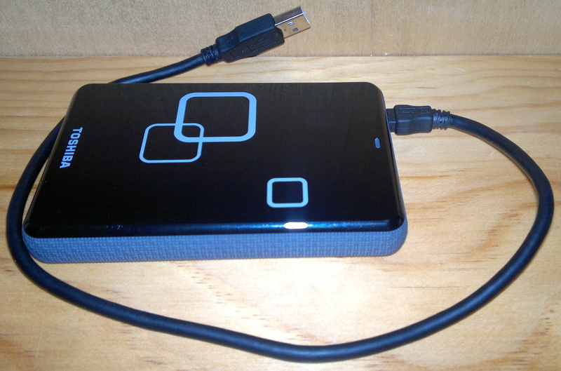 external, high angle view, communication, table, wood - material, toshiba, connector, charging cable, medical equipment, storage, still life, memory, internet