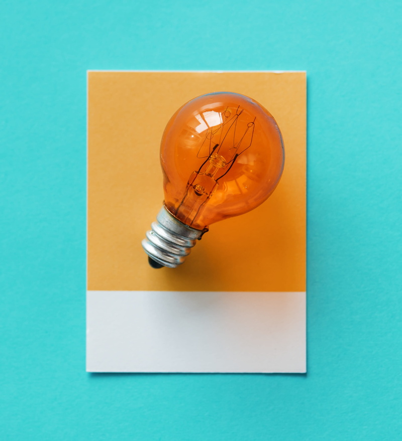 electric, blue background, creativity, art and craft equipment, watt, innovation, two objects, think, no people, tungsten, paper, pen, glowing, light, green