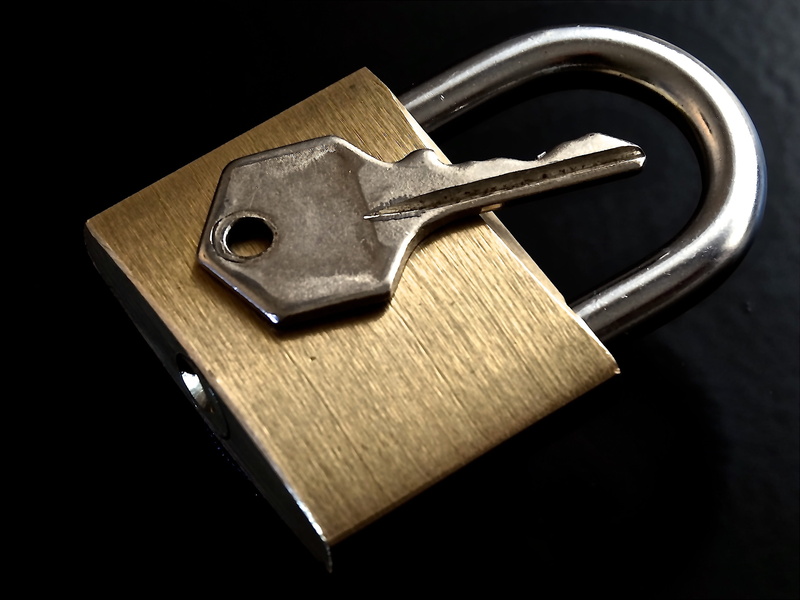 silver colored, security System, U-Lock, Metal, studio shot, shiny, protection, close-up, brass, golden, Closed, cut out, black background, sharp, to, backed up