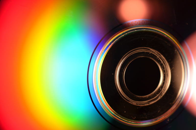 photographic equipment, technology, geometric shape, no people, selective focus, computer, byte, camera, photography themes, cd, lens - optical instrument