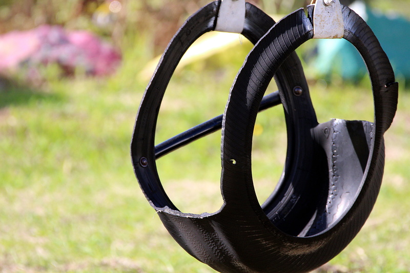shape, Rubber, rock, Swing, black color, childhood, mature age, recycling, play, focus on foreground, no people, about, nature, circle, geometric shape