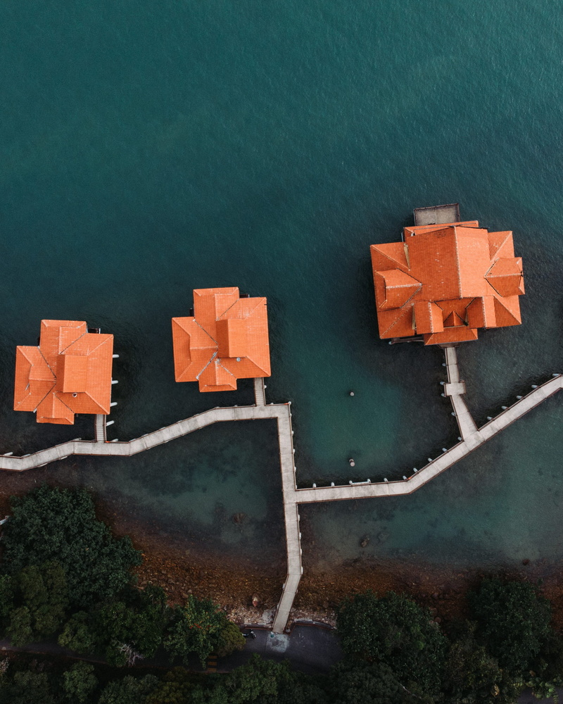 green color, rubix cube, orange color, drawing, no people, close-up, outdoors, wall, transportation, bird, built structure, water, directly above, day