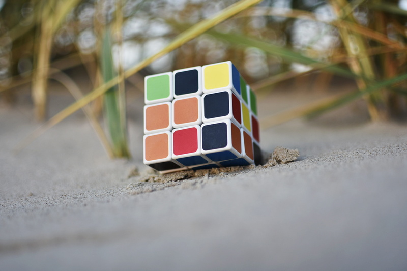 multi colored, outdoors, design, game, gaming outside, beach, nature, toy, cube, logic, close-up, still life, pattern, day, puzzle, no people, shape, sand