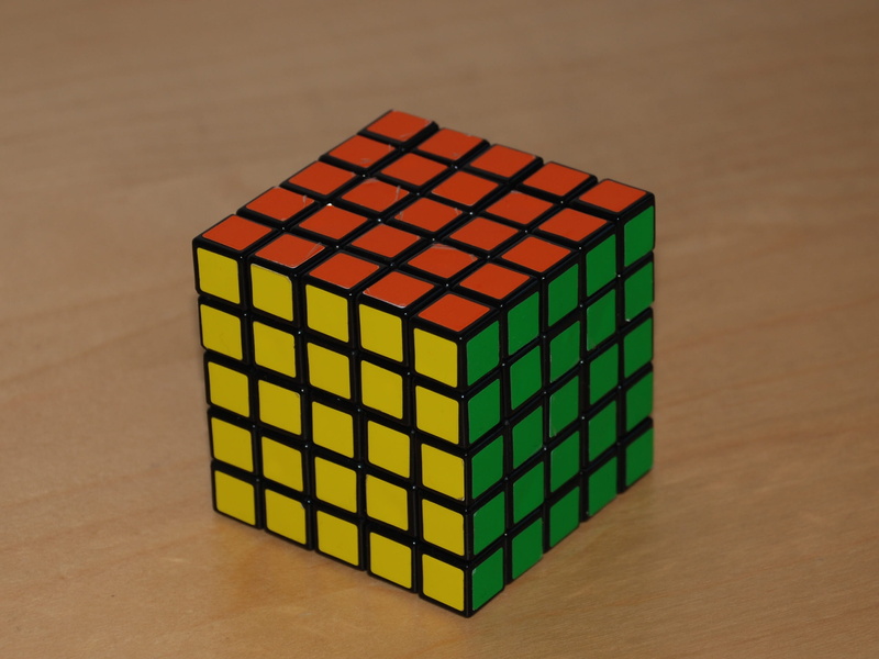 wood - material, block shape, pattern, puzzle, geometric shape, group of objects, rubiks cube, block, single object, design, intelligence, shape, table