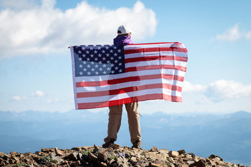 beauty in nature, solid, striped, man, sea, holding, banner, 4K, patriotism, outdoors, one person, red, national, real people, standing, white, mountain