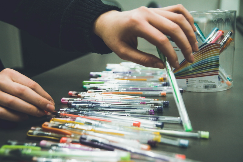 leisure activity, neonbrand digital marketing, art, creatity, colors, creation, stack, one person, gel pens, focus on foreground, utenciles, work, table