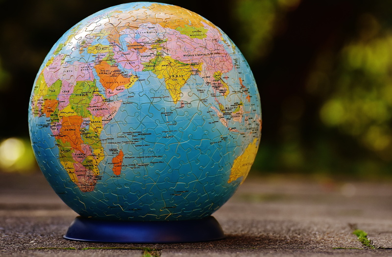 puzzle piece, focus on foreground, outdoors, puzzle, earth, global business, physical geography, world map, toys, globe - Man Made Object, nature, planet - Space