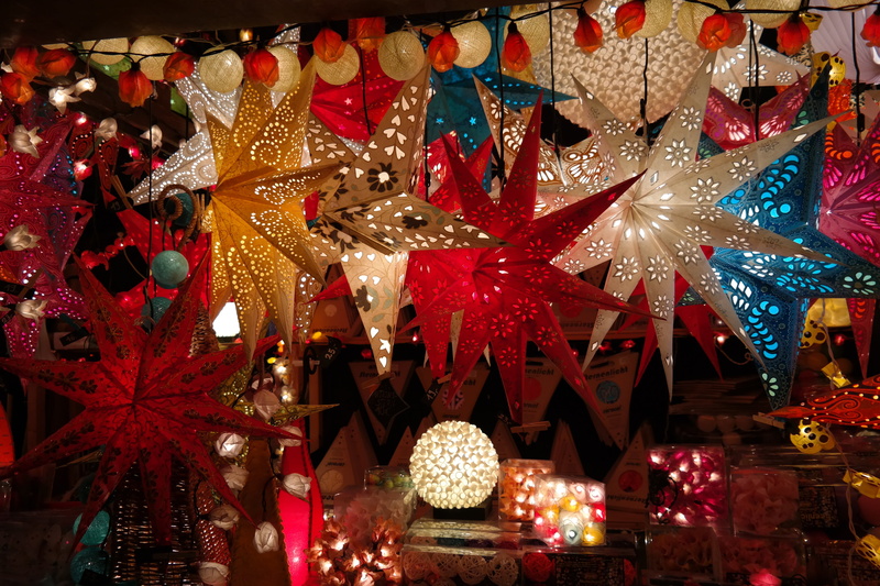 stall, no people, indoors, star, christmas lights, several, hanging, christmas ornament, christmas decorations, night, tree, color, lighting equipment