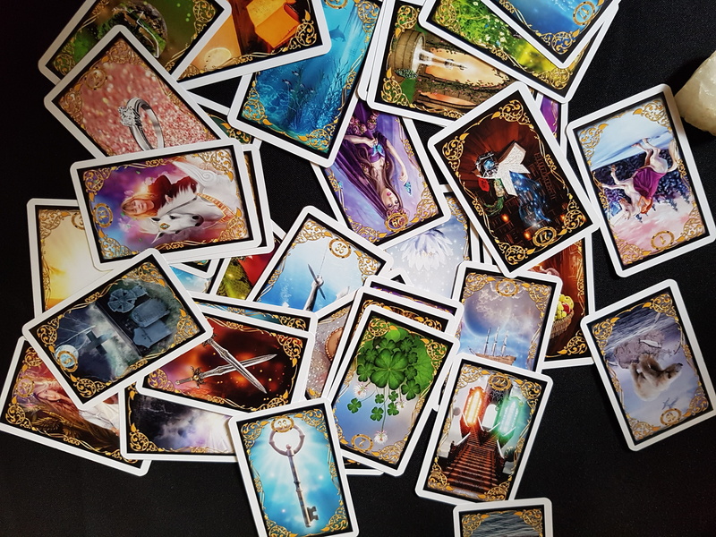 large group of objects, human representation, close-up, old, full frame, new age, picture frame, oracle, retro styled, black background, still life, cards