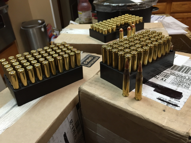 armed, day, abundance, text, box - container, large group of objects, no people, indoors, side by side, pistol, ammo subscription, ammo drop, high angle view