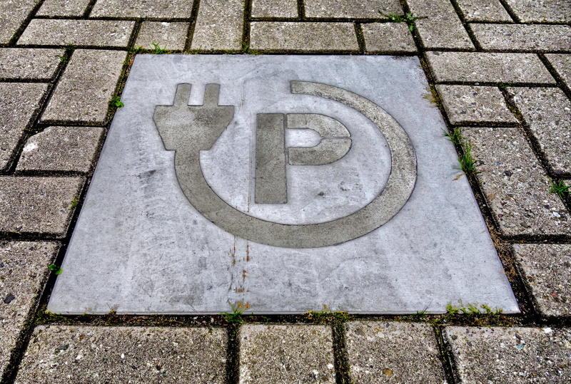 electric car, icon, power punt for electric car, symbol, disabled access, number, outdoors, stone, representation, concrete, brick, disabled sign, tile
