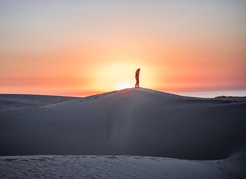 beauty in nature, thought, sun, love, ocean, peak, horizon, leave, standing, environment, stand, land, one person, explore, outdoors, silhouette, sunlight