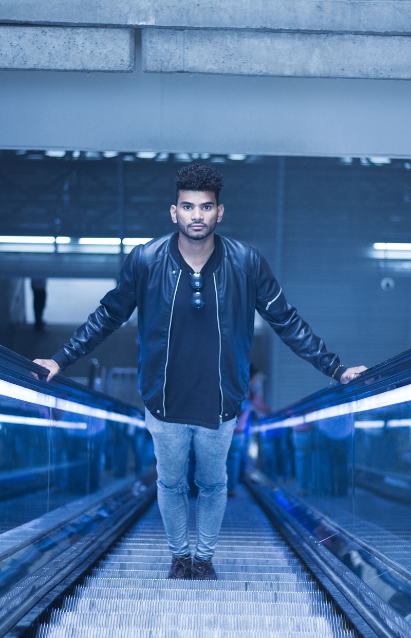 young men, transportation, stairs, jacket, face, front view, architecture, watching, urban, casual clothing, leather jacket, portrait, outdoors, leather