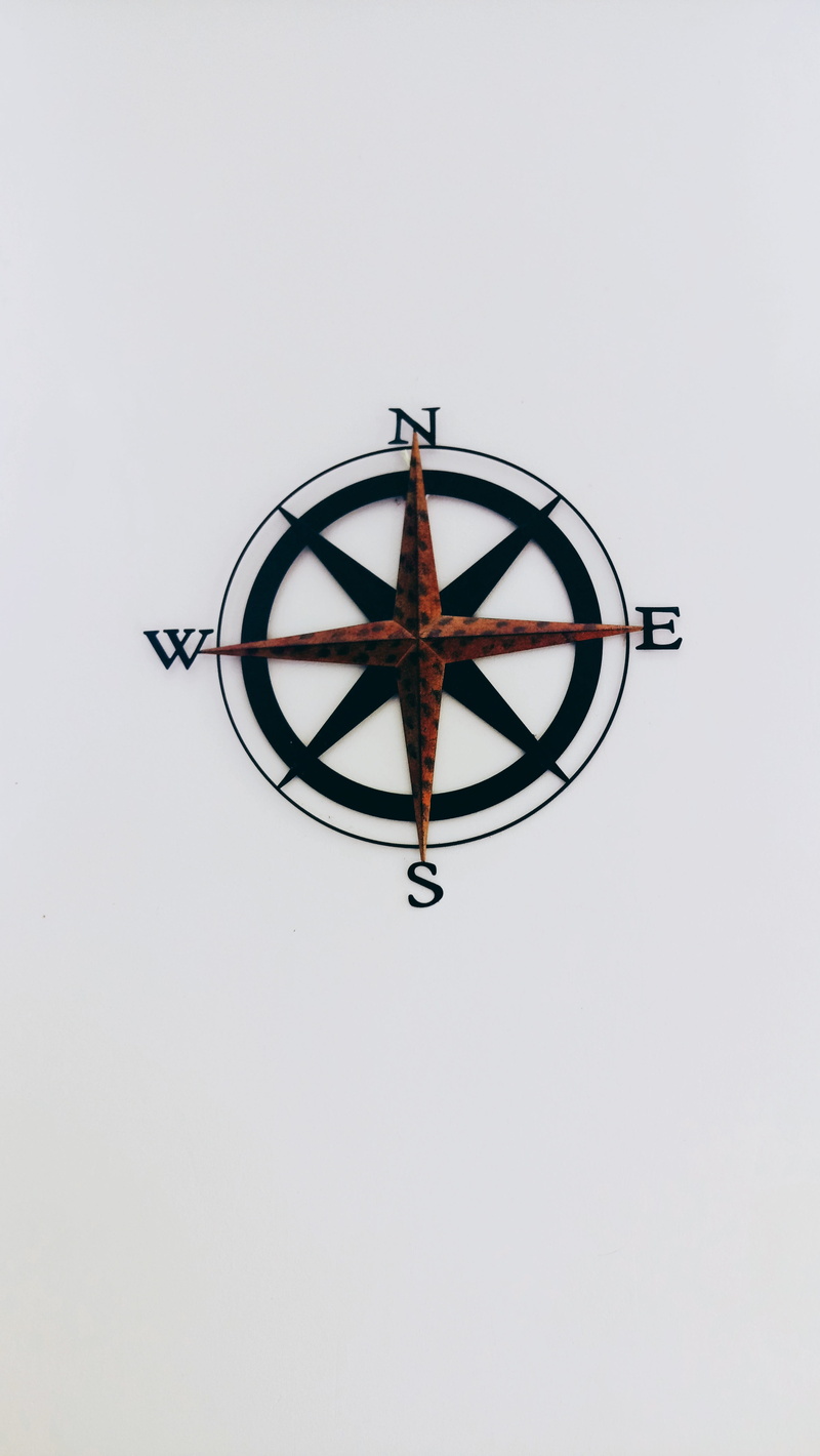 old, low angle view, indoors, white background, wheel, west, compass, 5K, decor, built structure, clear sky, geometric shape, wall - building feature