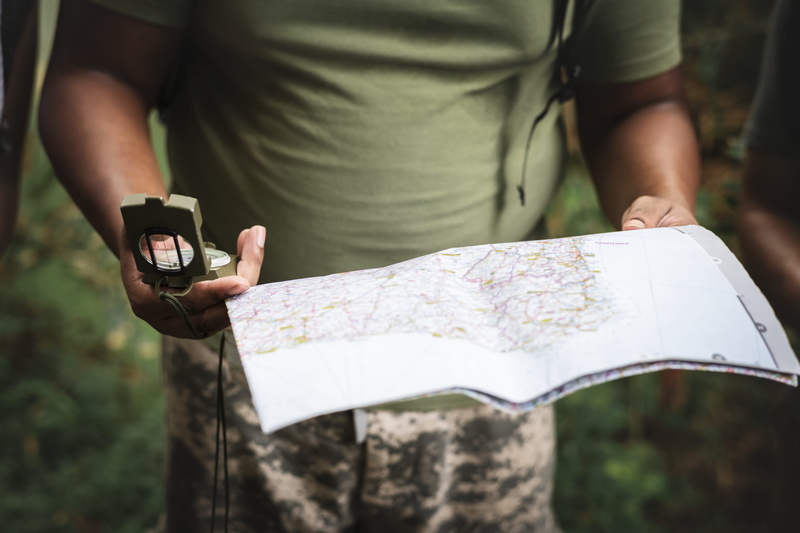 standing, navigation, man, tourism, guide, day, hand, direction, close-up, person, navigating, adventure, casual clothing, compass, real people, holding