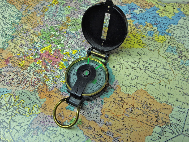 high angle view, technology, orientation, navigational compass, world map, outdoor, guidance, table, close-up, still life, antique, pattern, multi colored