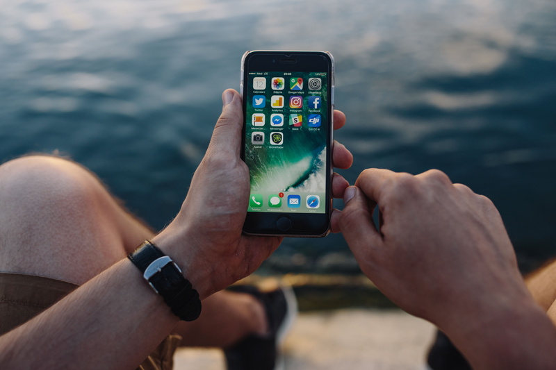 mobile, travel, outdoors, screen, one person, focus on foreground, outdoor, sea, men, s, smartphone, equipment, male, editorial, water, portable information device