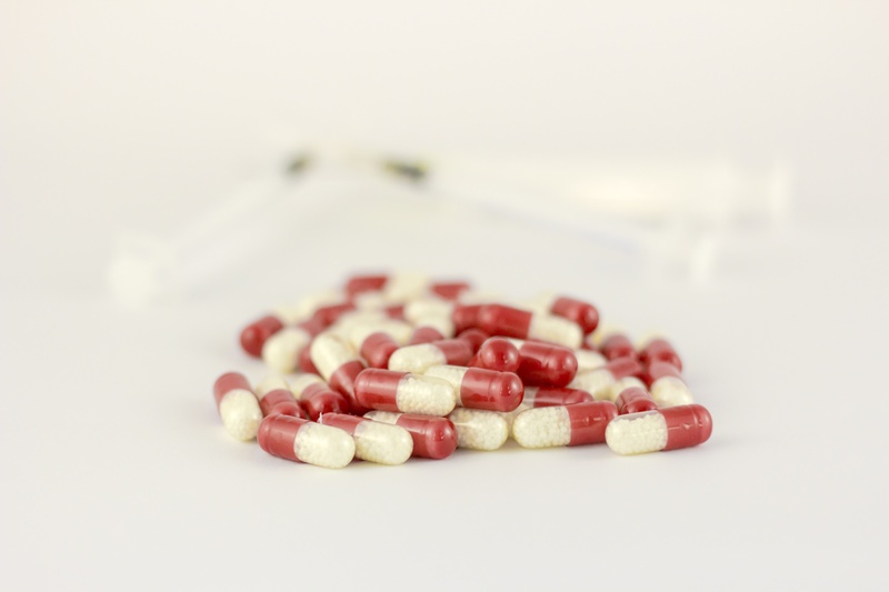 large group of objects, the pill, selective focus, needle, red, indoors, vitamin, medical, food, science, syringes, no people, capsule, pill, overdose