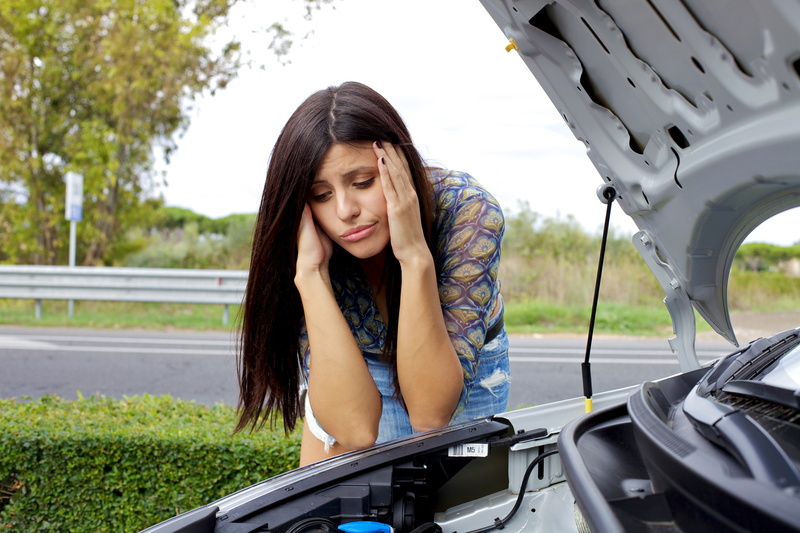 lifestyles, young women, mode of transportation, land vehicle, real people, hair, one person, women with cars, vehicle breakdown, front view, frustration