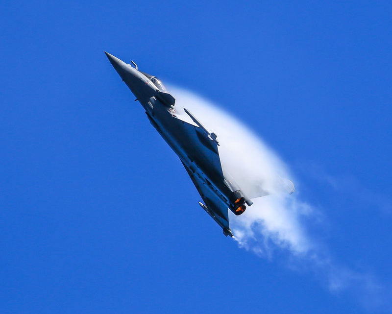 no people, mid-air, low angle view, blue, flying, day, air force, air vehicle, cloud - sky, travel, motion, on the move, sky, aircraft, airplane, nature