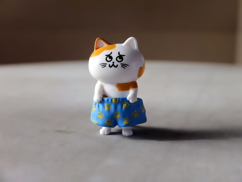 plastic, single object, close-up, human representation, toy, character, domestic, cartoon, anime, focus on foreground, television, white color, no people