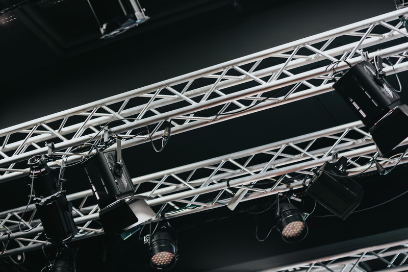 industry, black background, equipment, illumination, no people, close-up, low angle view, metal, strength, connection, lamp, day, indoors, display, chandelier