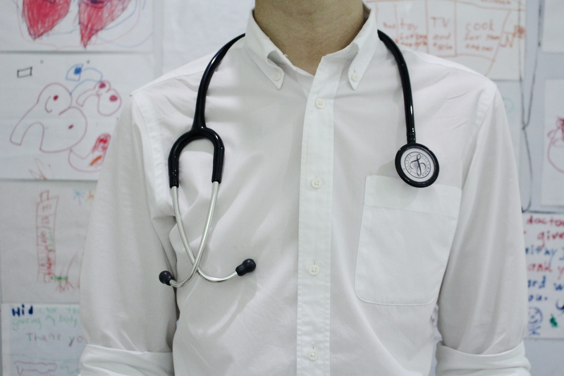physician, dress, midsection, health, clinic, clothing, standing, shirt, medical equipment, one person, medical instrument, healthcare worker, occupation