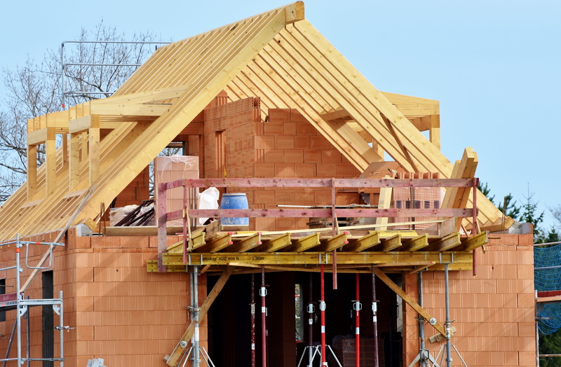 residential district, built structure, sky, shell, unfinished, outdoors, construction machine, maurer, wood - material, scaffold, house, no people, day
