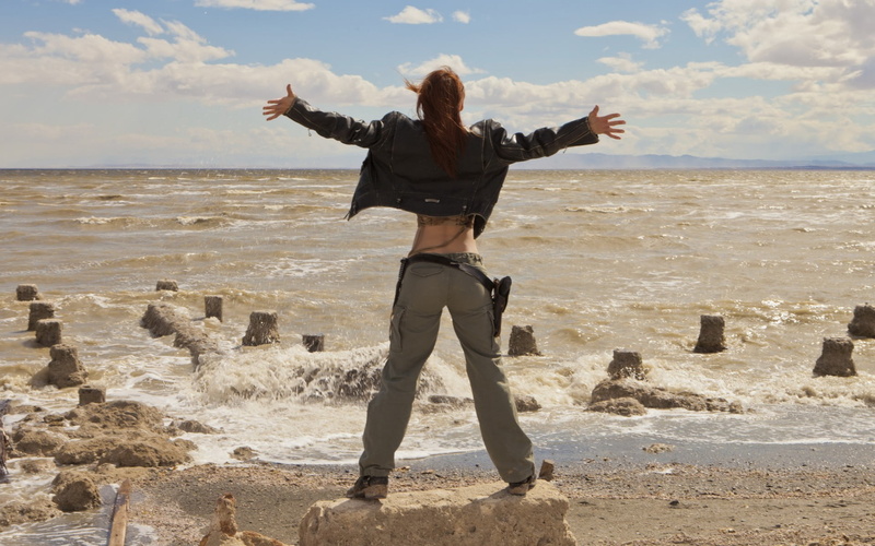 holster, leisure activity, limb, beauty in nature, horizon over water, women, hairstyle, women outdoors, land, human arm, beach, full length, lifestyles